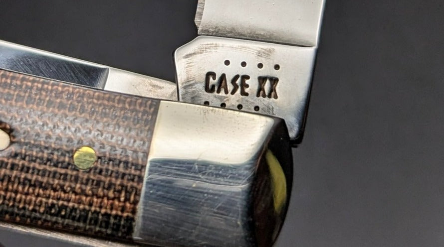 Case Trapper 23470 Smooth Black/Green Natural Canvas Micarta (10254 SS) Tang Stamp Front
