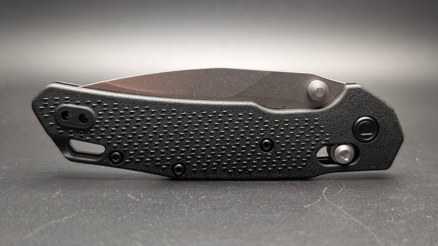 Folding knife Closed on a gray surface