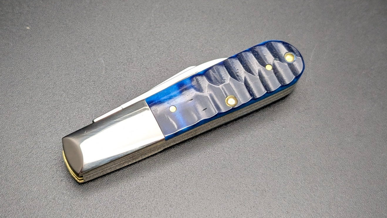 Small Knife with blue accents on a dark gray background