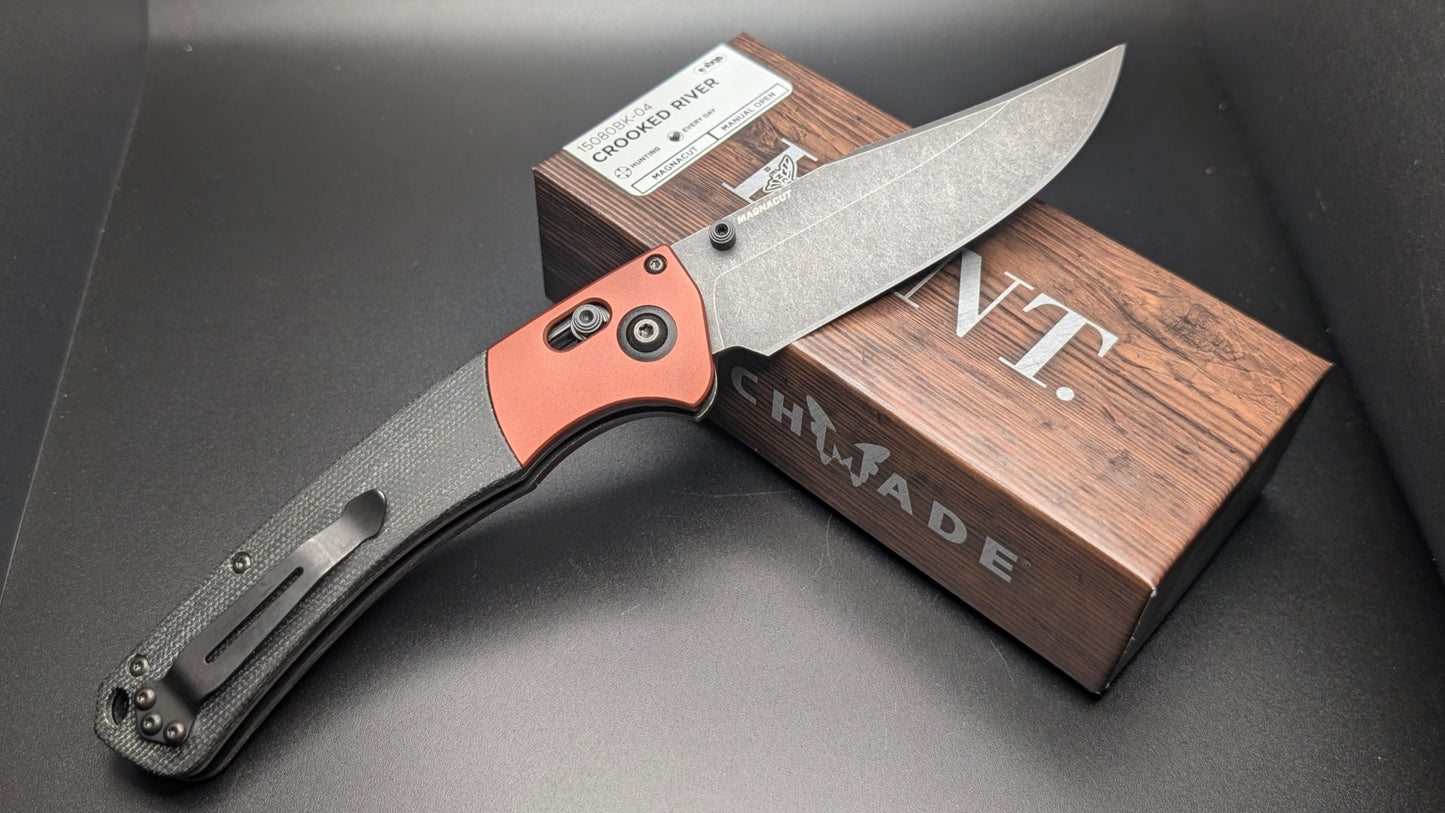 Folding knife with Hunt box on a dark background