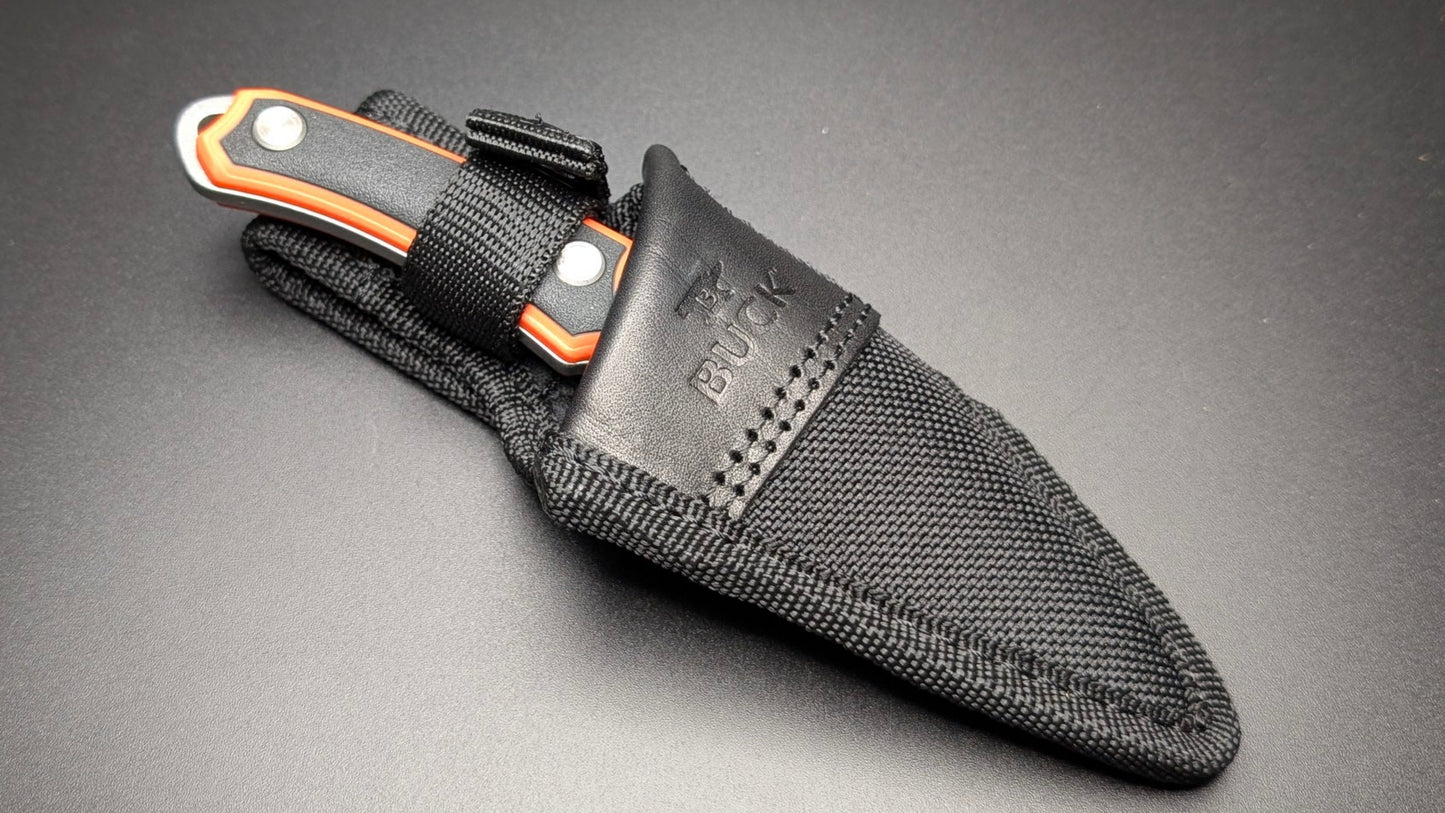 Orange knife with sheath on a dark gray background