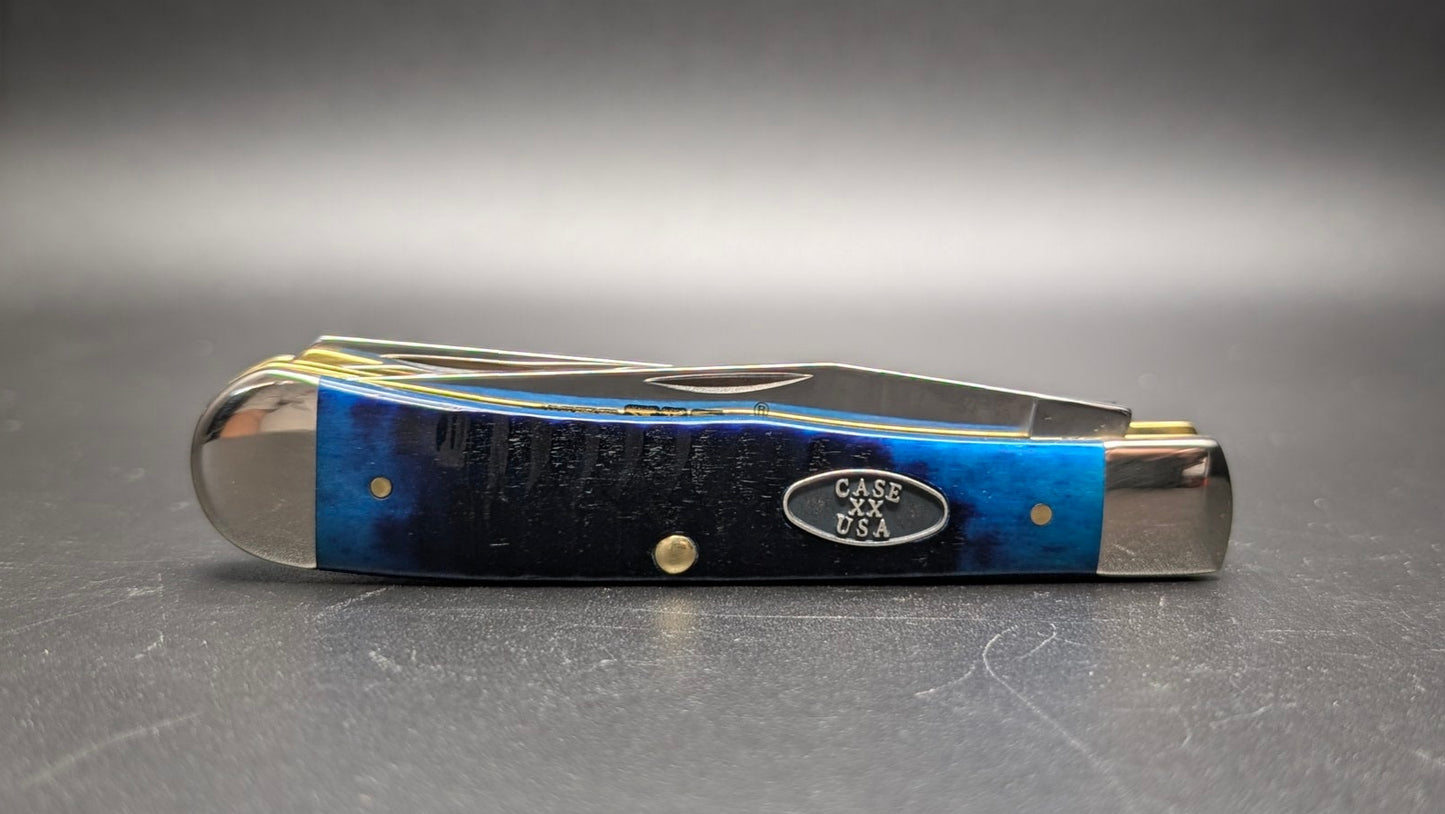 Small pocket knife with blue handle on a gray background