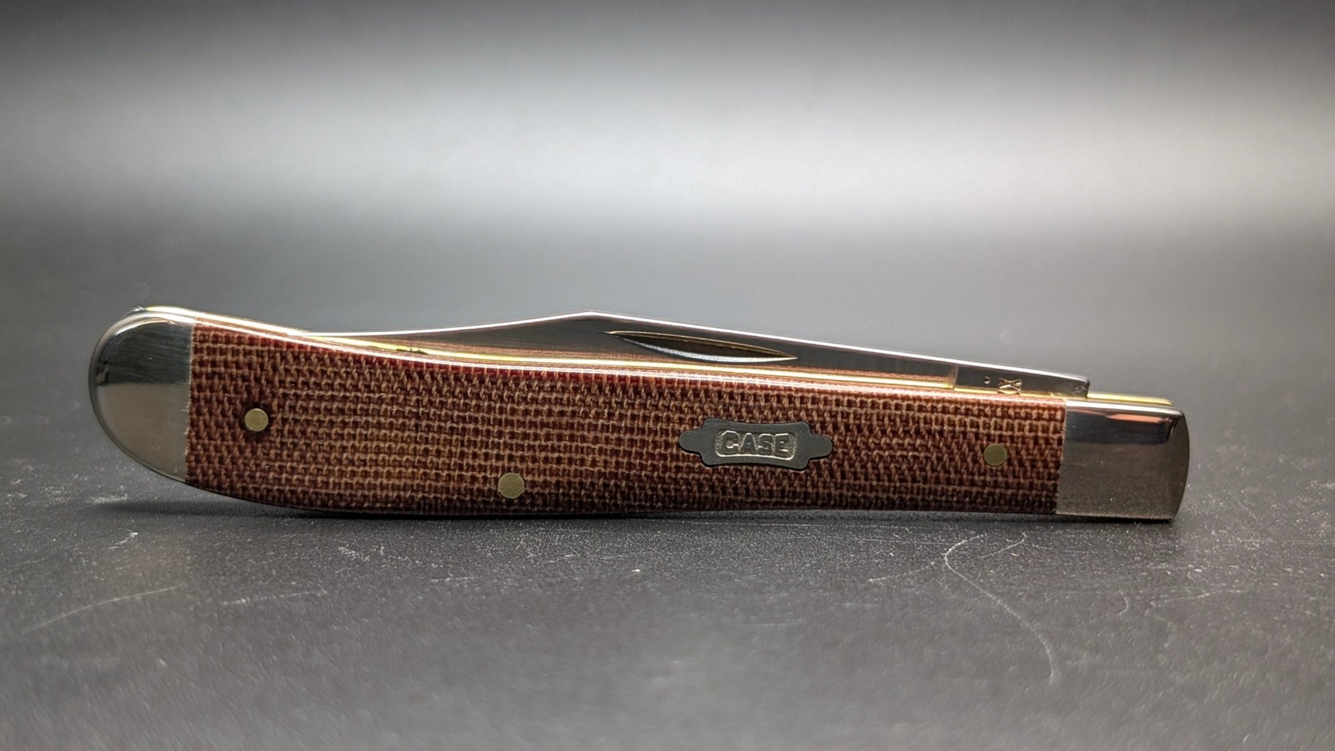 Closed Front Case Slimline Trapper Natural Canvas Micarta Smooth Model #23691 Pattern (101046 SS)