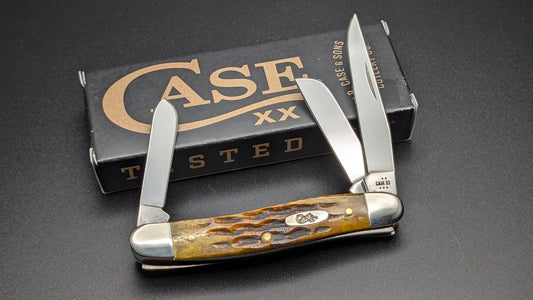 Case Honeycomb Bone Heritage Jig Medium Stockman Model #32272 Pattern (6318 SS) Open Front with Box on a gray surface