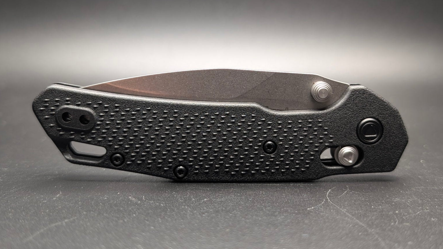 Folding knife Closed on a gray surface