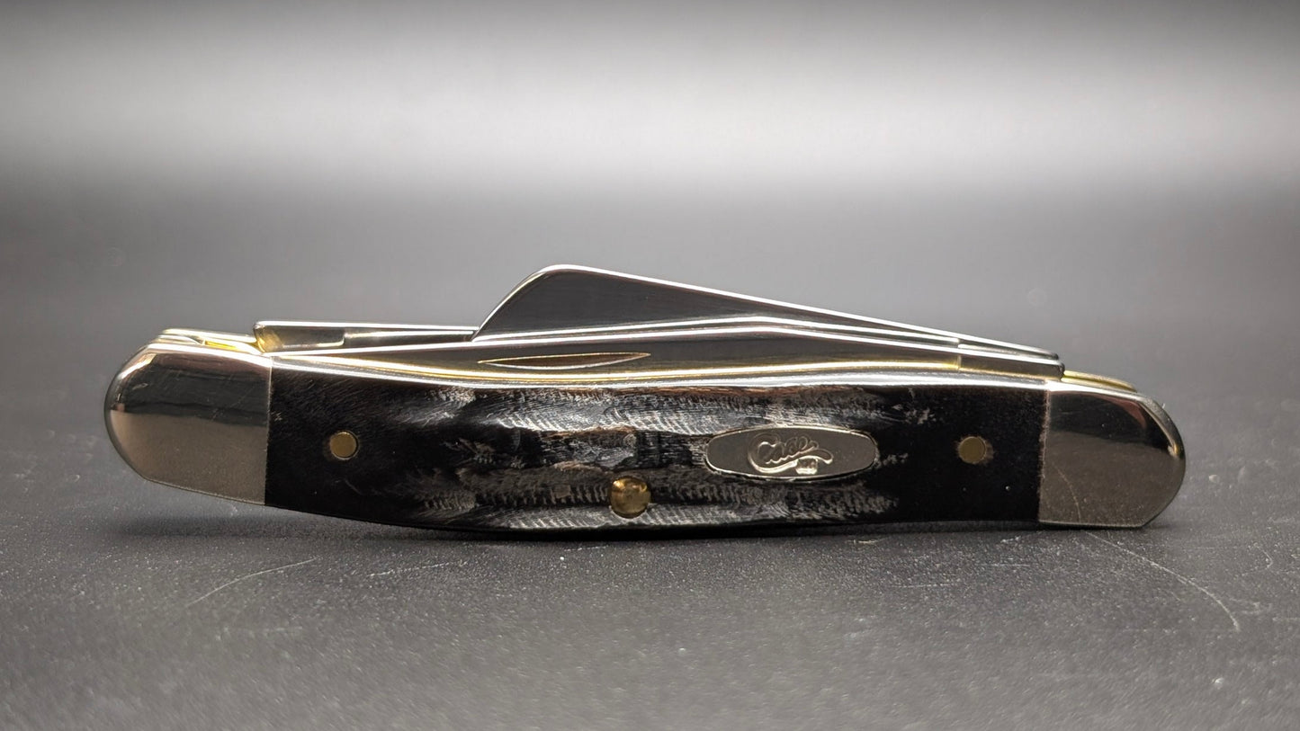 Case Buffalo Horn Jig Medium Stockman Model #66028 Pattern (BH318 SS) Closed Front on gray background