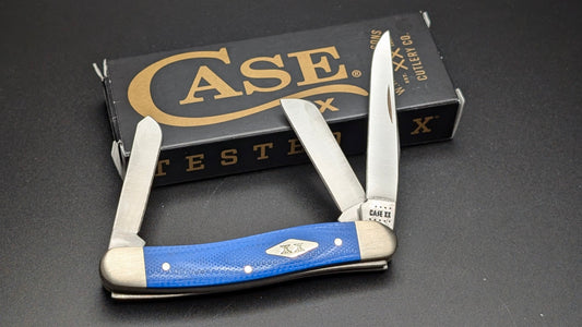 Case Blue G10 Smooth Medium Stockman Model #16752 Pattern (10318 SS) Open Front on Gray surface with box