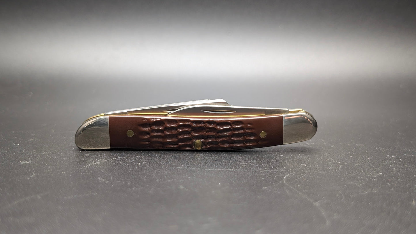 Delrin Brown Stockman Case Knife Back Closed on a dark gray surface