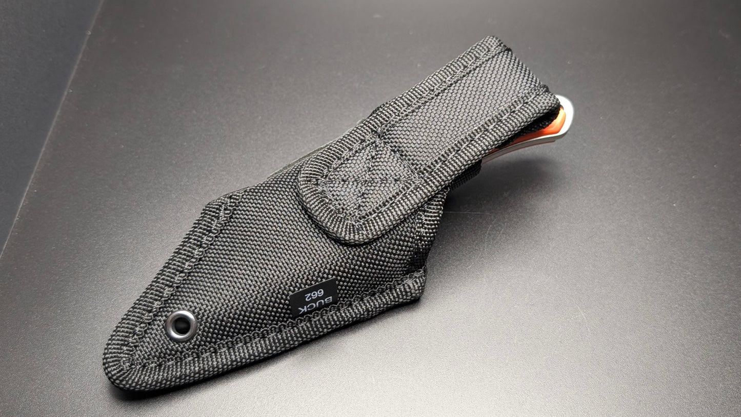 Black knife sheath on a gray surface